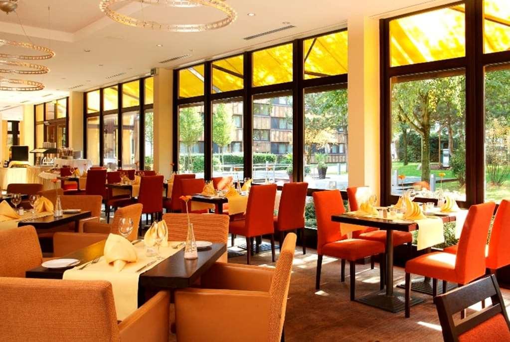 H+ Hotel بوخوم المطعم الصورة